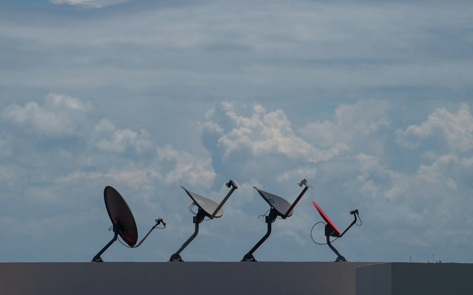 Satellite internet dishes mounted on a rooftop for business connectivity