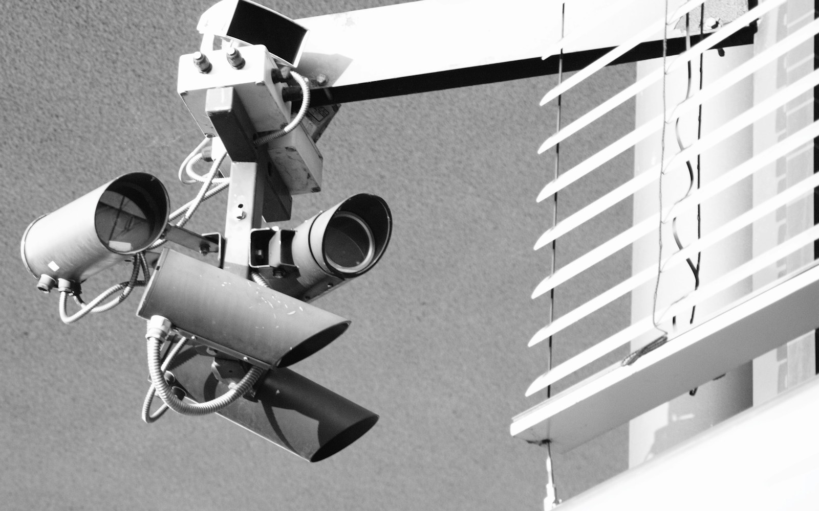 Multiple security cameras mounted on the exterior of a business building